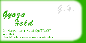 gyozo held business card